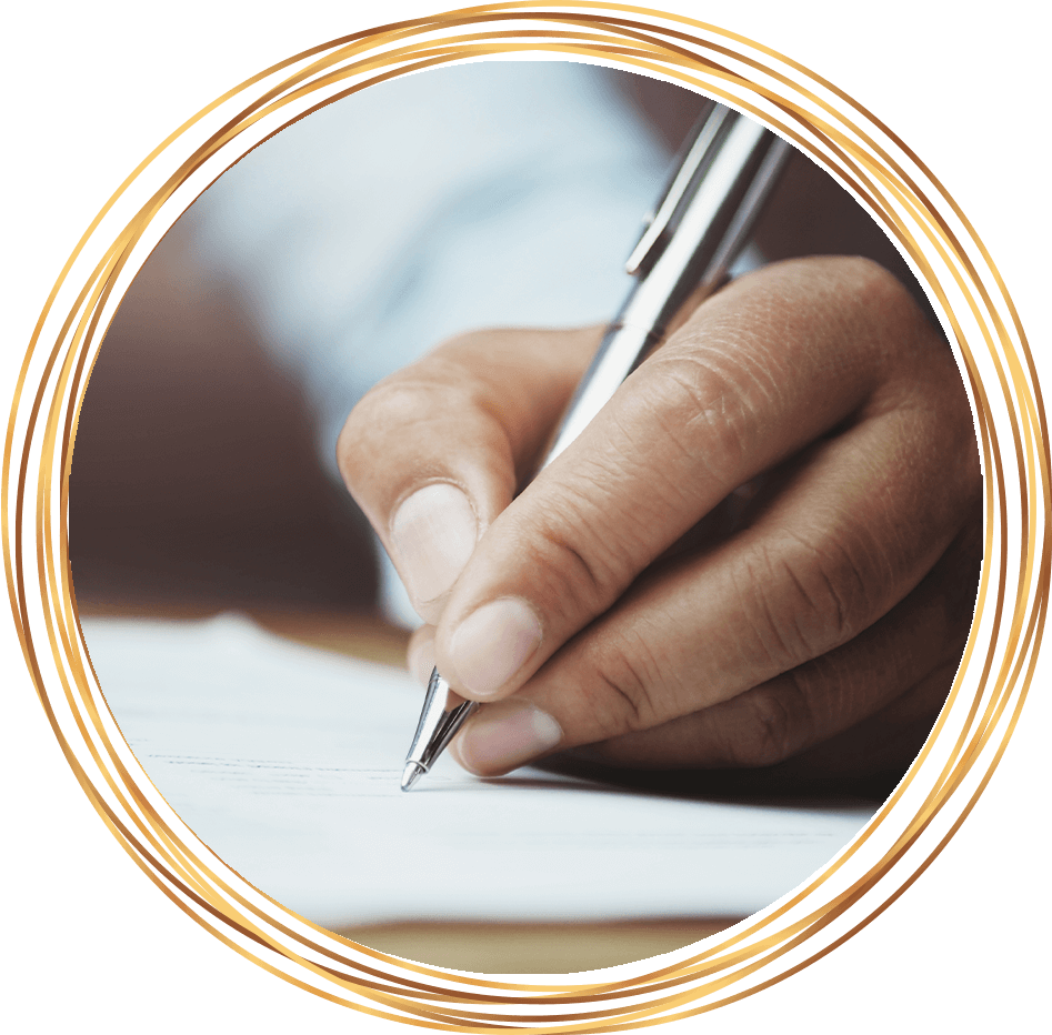 hand holding pen writing on paper